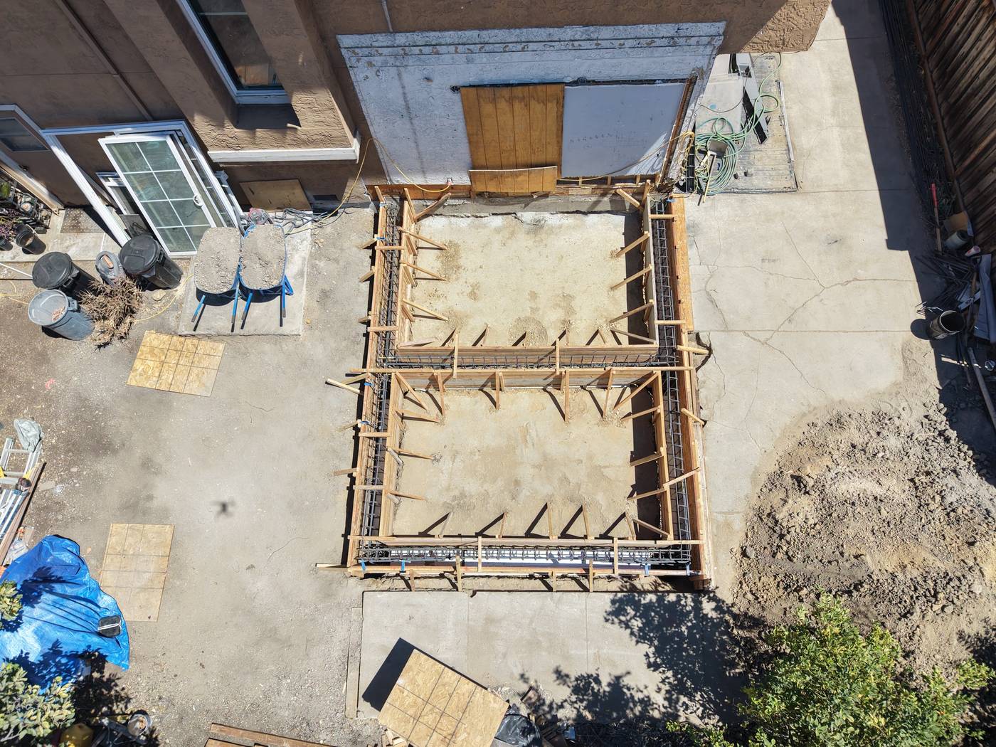 Completed forms and rebar for a home addition foundation, ready for inspection