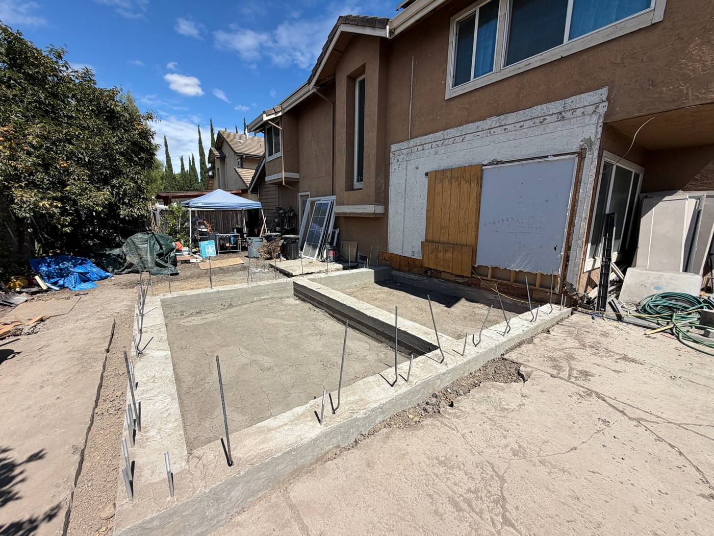 Poured concrete slab for a home addition in Milpitas with dowels set