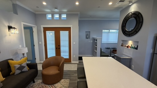 ADU living area looking toward the glazed entry doors with clerestory windows above