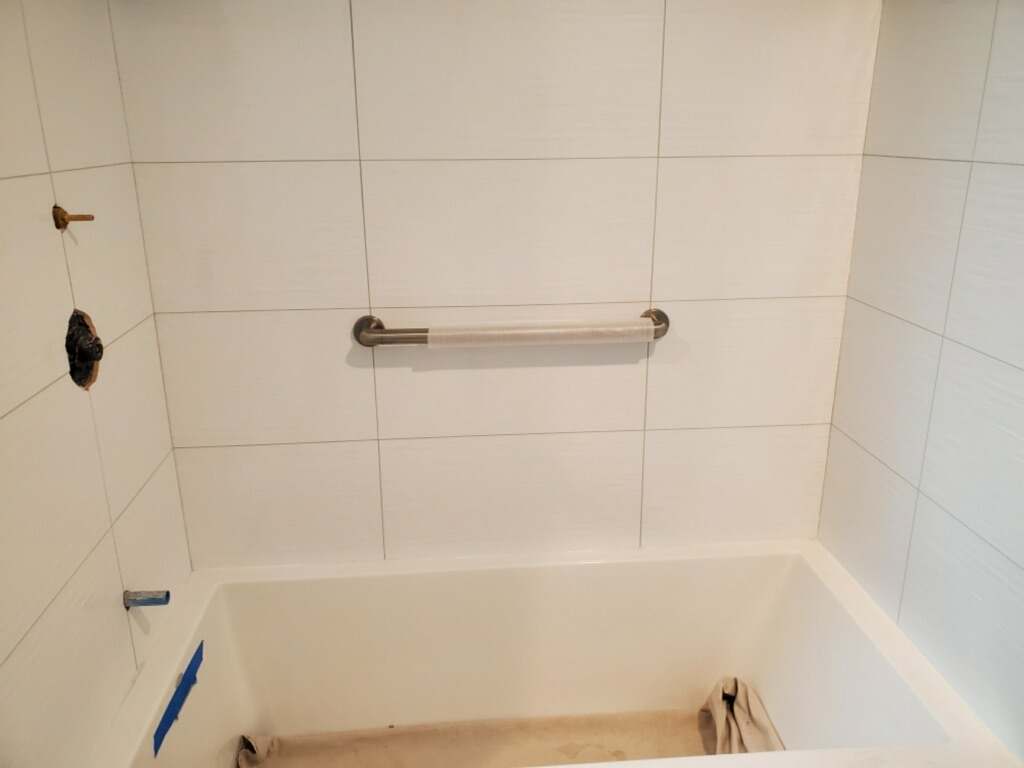 Tiled bathroom remodel with waterproofed shower surround