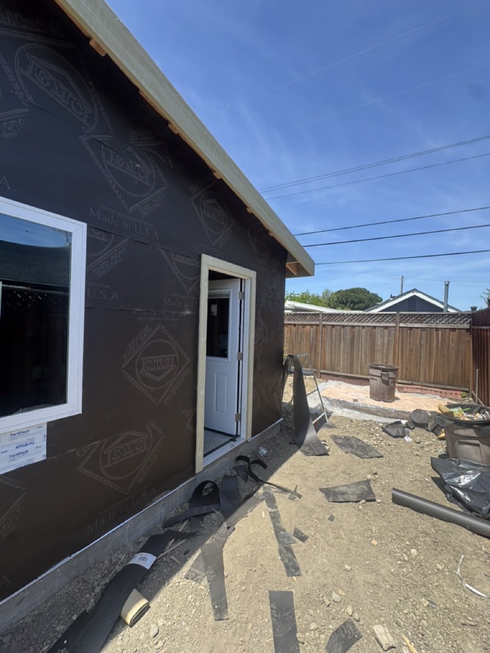 Weather-resistive barrier wrapped over exterior sheathing on a San Jose ADU conversion