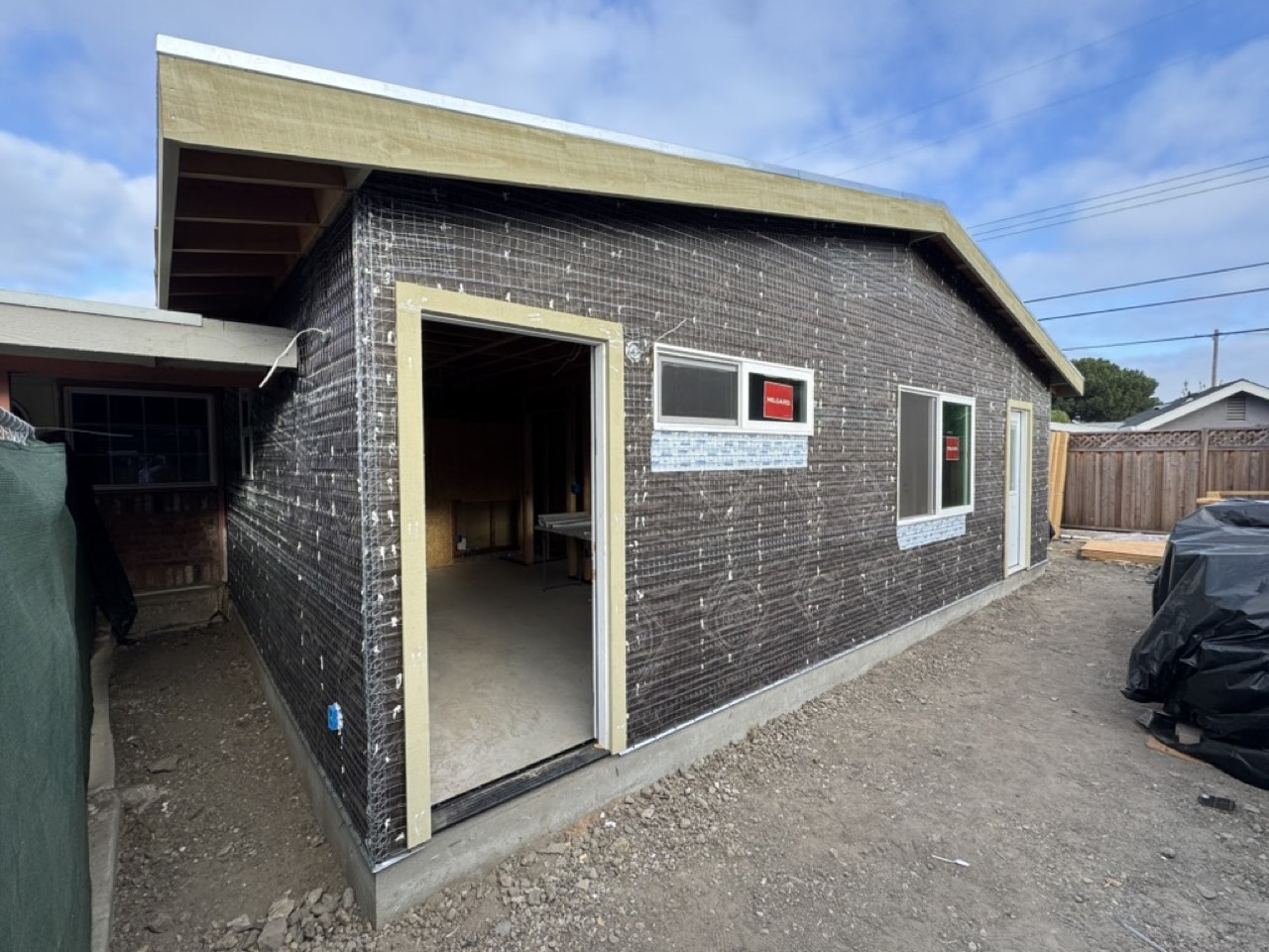 Metal lath fastened over the weather barrier in preparation for stucco on a San Jose ADU