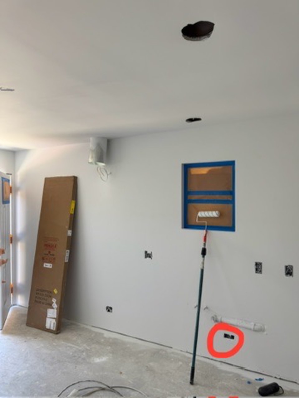 Drywall surface with a defect circled in red during quality inspection on a San Jose ADU