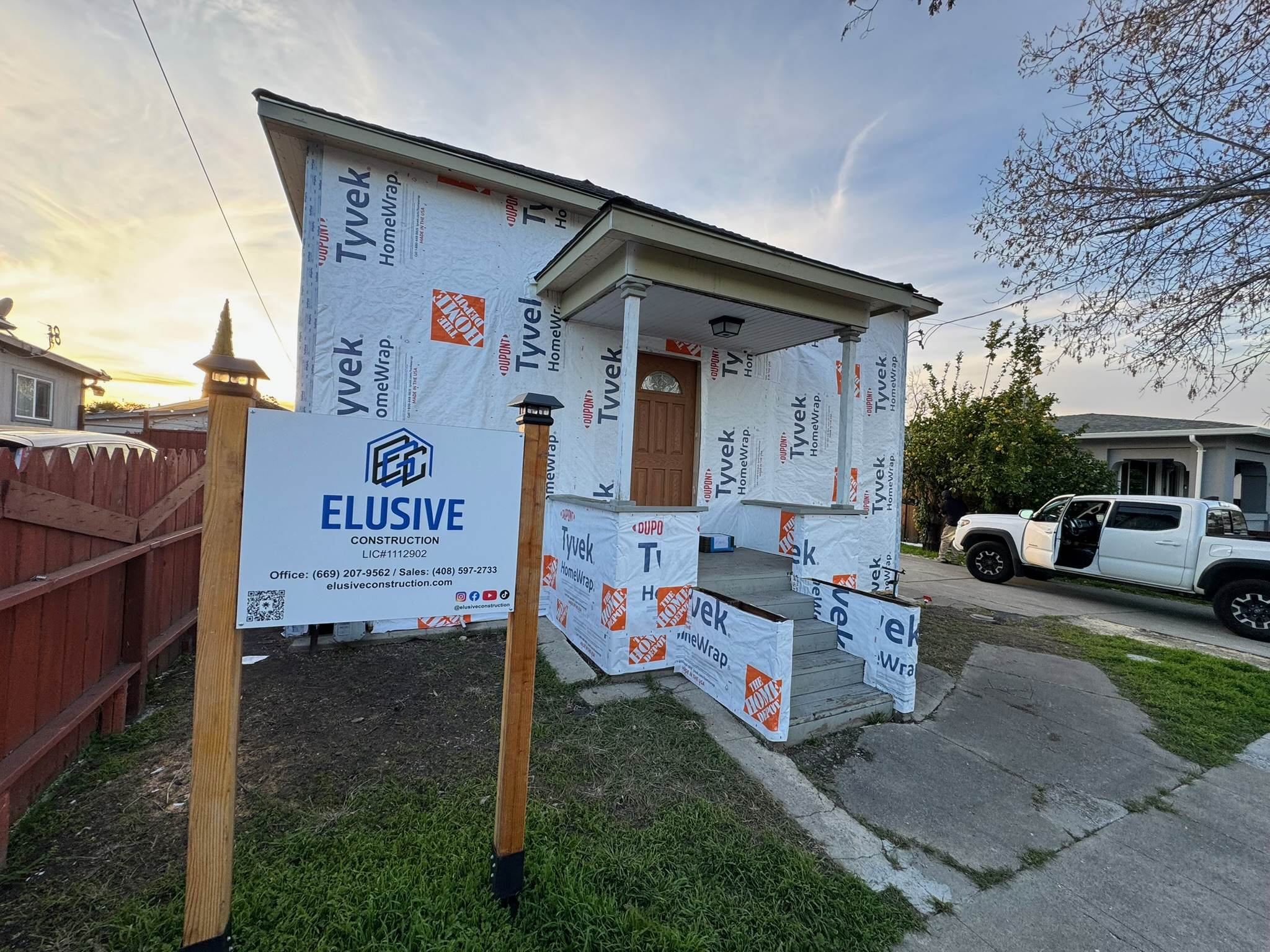 Home under construction with the Elusive Construction site sign