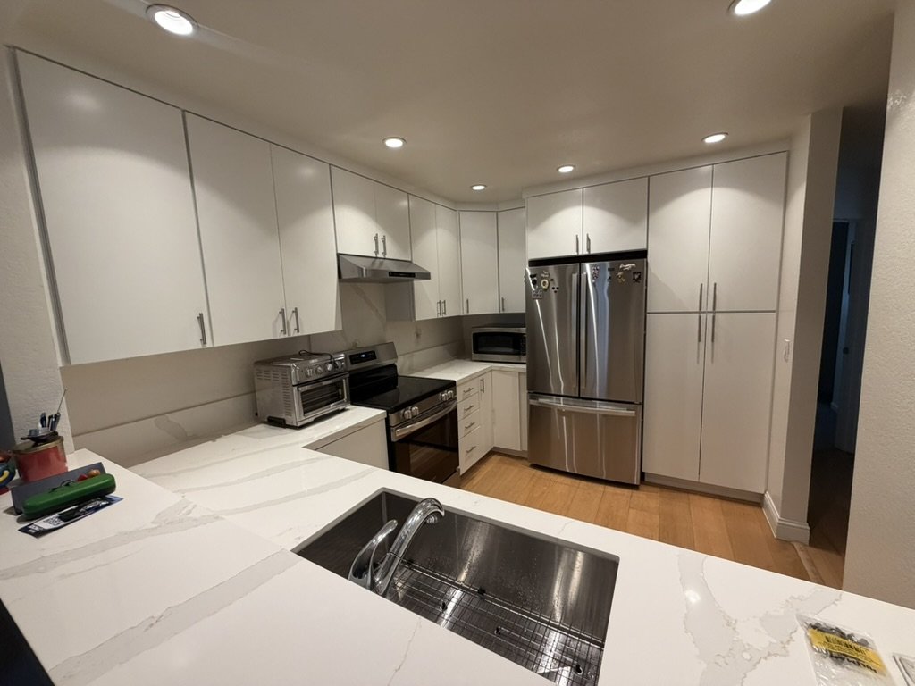 Wide view of the finished kitchen from the peninsula sink, in daily use