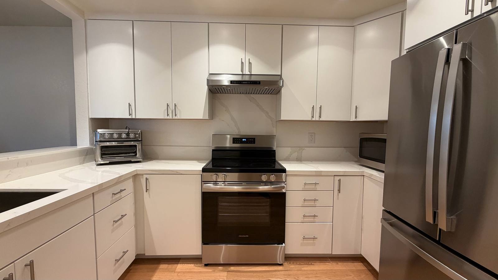 Completed kitchen remodel in San Jose with new cabinetry, quartz counters and stainless appliances