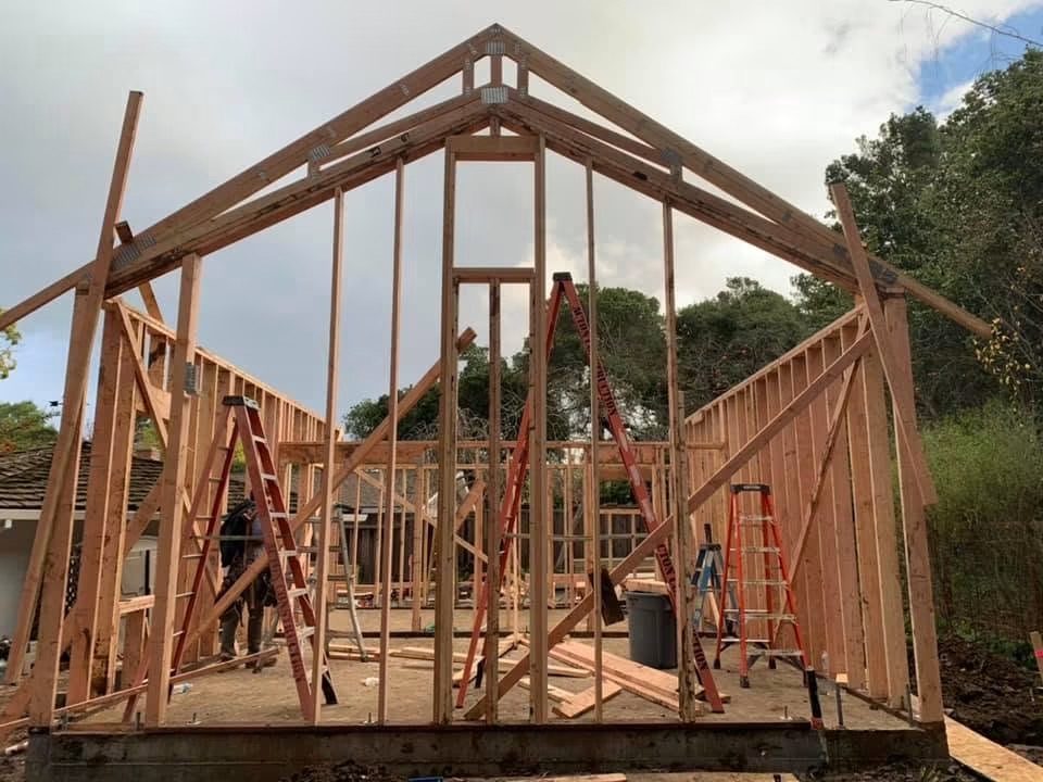 Crew setting roof trusses on a San Jose build
